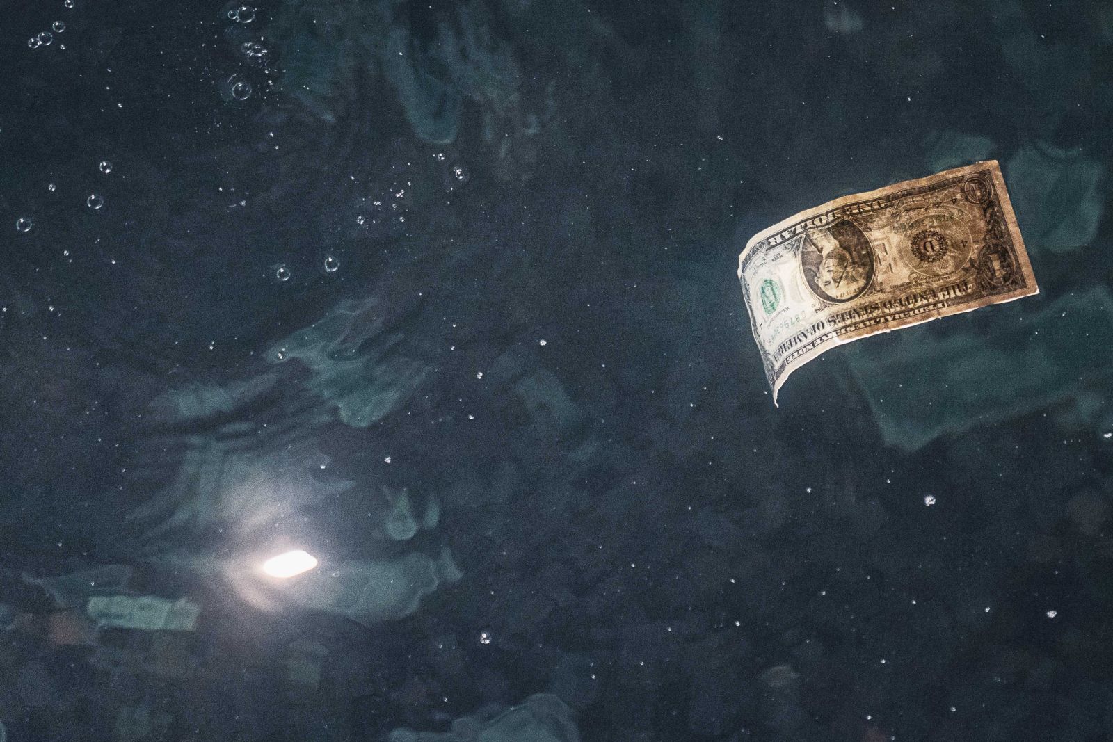 Dollar Slips on Reduced Fed Rate Hike Chances
